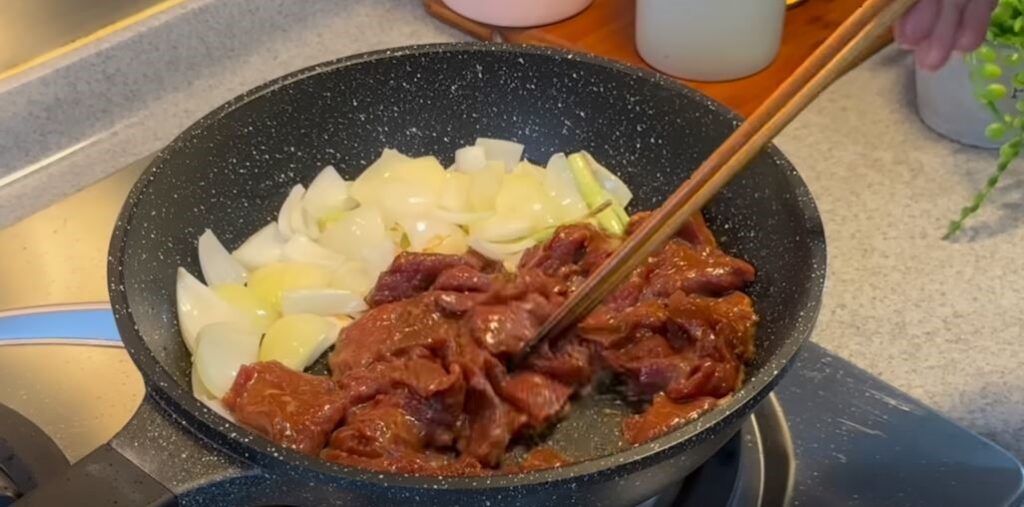 sauteing onion and steak