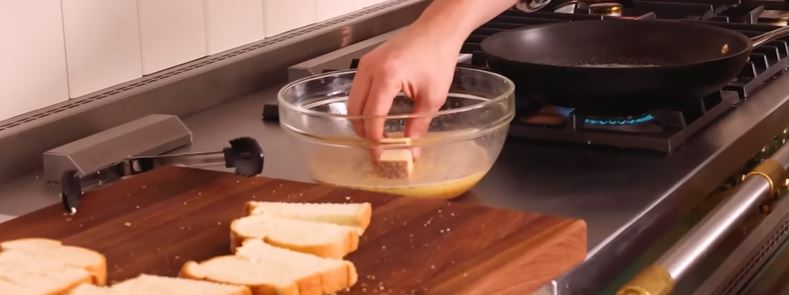 dipping bread in batter